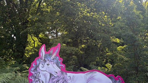 A unicorn illustration sat amongst the planting at Sheffield Park and Garden